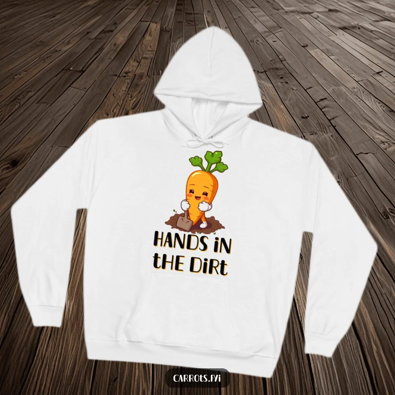 Funny hoodie featuring a carrot character wearing miniature gardening gloves, happily digging into the soil with enthusiasm.