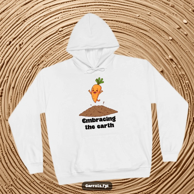 Funny hoodie featuring a spirited carrot character making an enthusiastic leap into a pile of rich, dark soil.